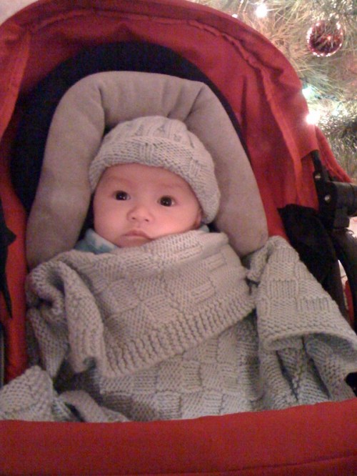 Jan's great-nephew snuggled up in hat and blanket!